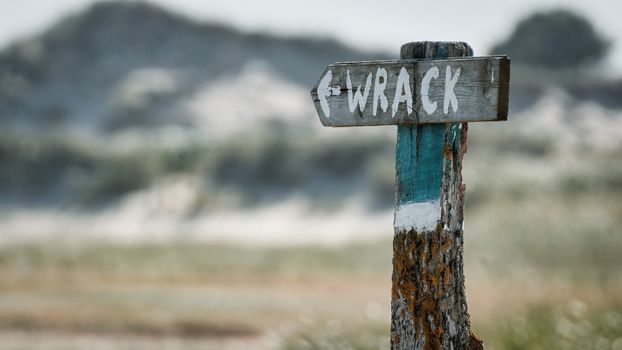 Wooden Signage on a Pole