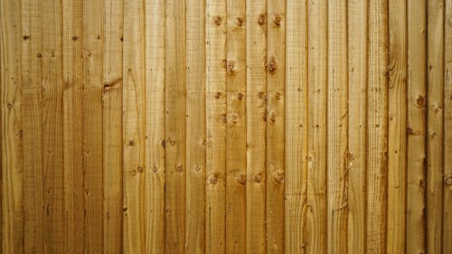 Brown Wooden Fence  in Vertical Pattern