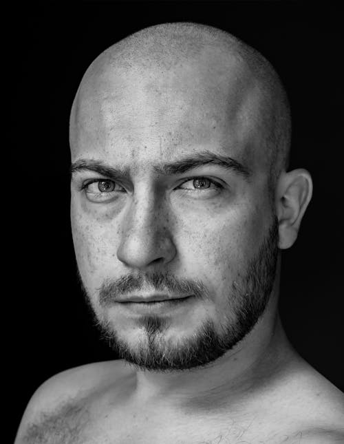 A Close-up Shot of a Bald Man