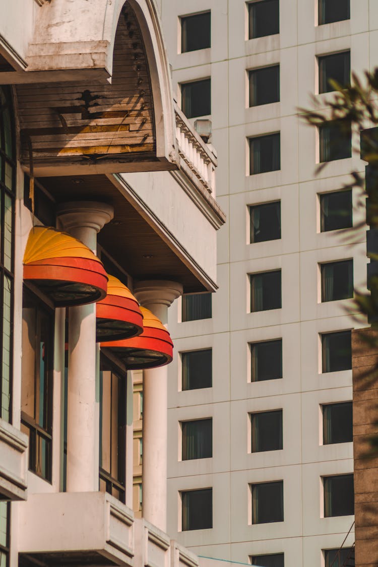 Arched Canopies Over The Building Windows