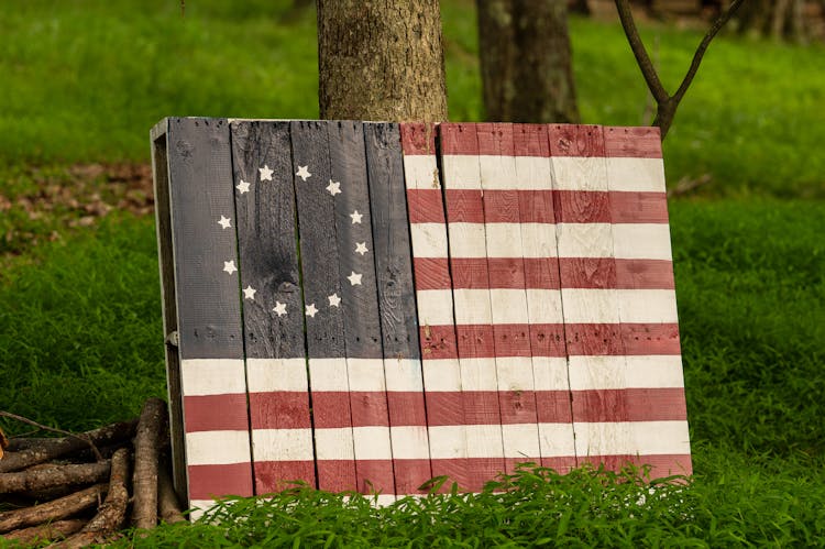 A Wood Painted With The Early Betsy Ross Flag Design