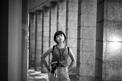 Grayscale Photo of Pretty Woman with a DSLR Camera