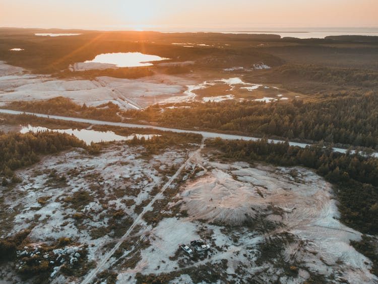 Snow Covered Field During Sunset