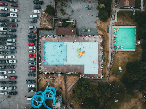 Free Aerial View of a Swimming Pool Near the Carpark Stock Photo