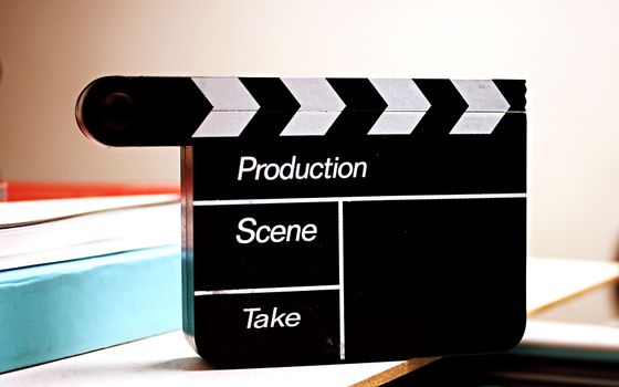 Film clapperboard on a desk — photo by Obregonia D. Toretto on Pexels