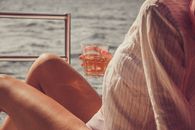 Close Up Photo of a Woman Holding a Drink