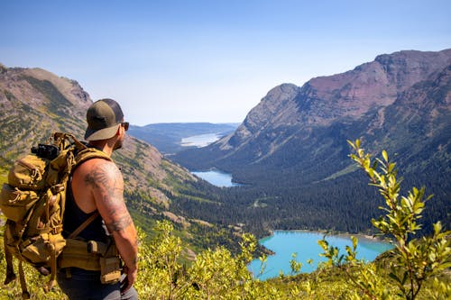 Man with Brown Backpack Looking at the View