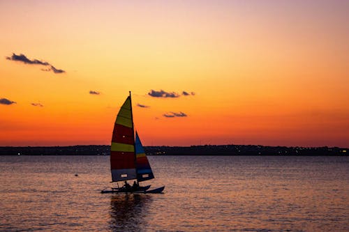 Free Sailboat on Sea during Sunset Stock Photo