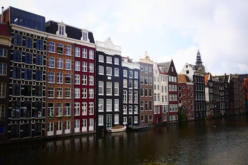 Free The Canal Houses Over River Amstel in Amsterdam, Netherlands Stock Photo
