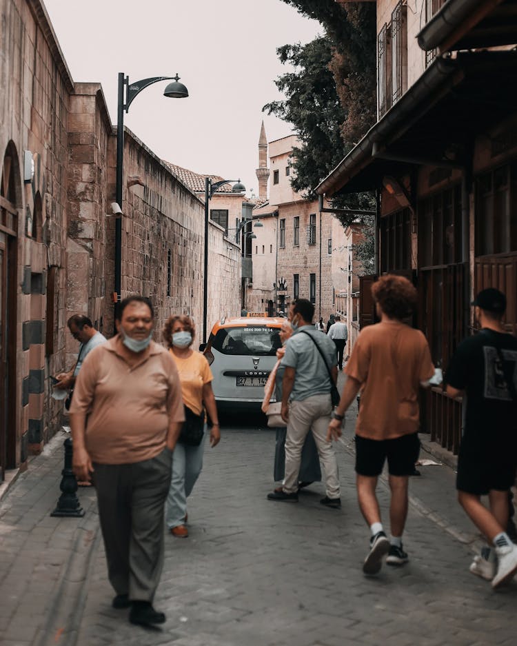 People Walking On Street With Face Masks