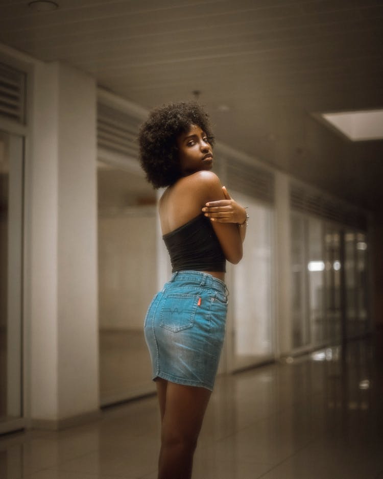 Woman In Blue Denim Skirt And Black Tube Top