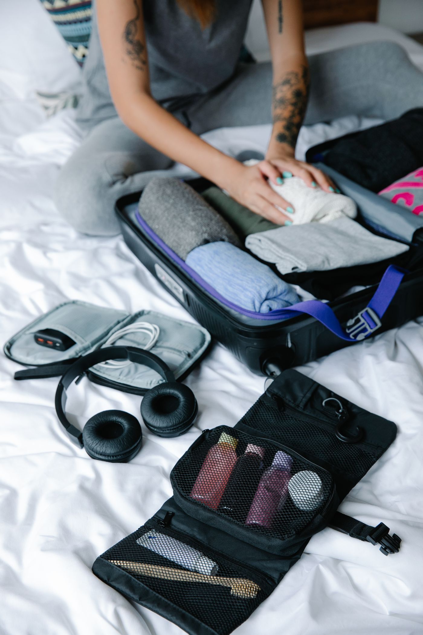 Organized suitcase with clothing and toiletry travel essentials