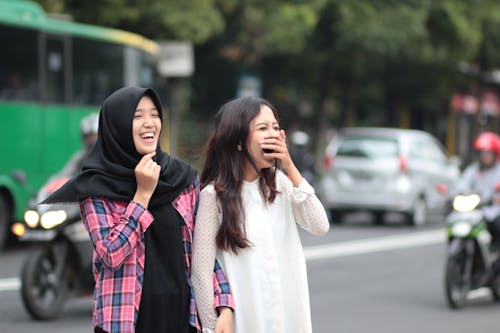 Two Women Laughing at Street