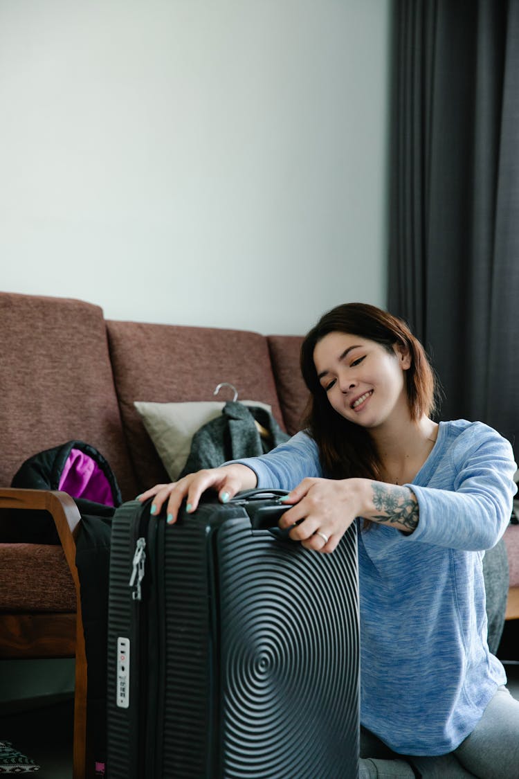 Happy Woman Holding A Luggage