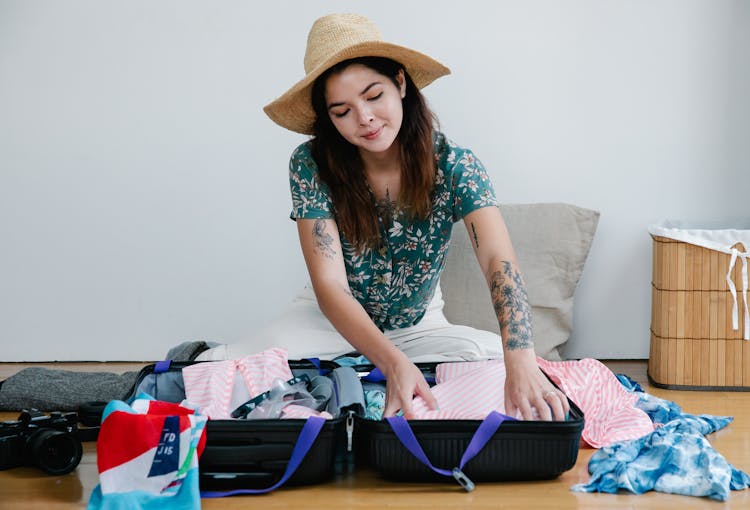 Woman Packing For Vacation