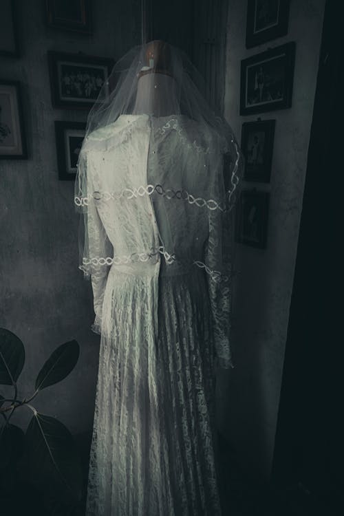 A Wedding Dress and Veil on a Mannequin