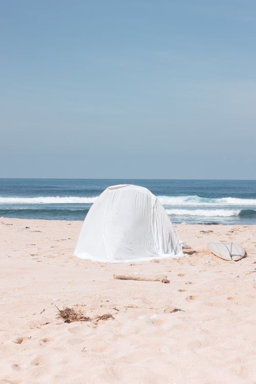 A White Tent on the Beach Sand