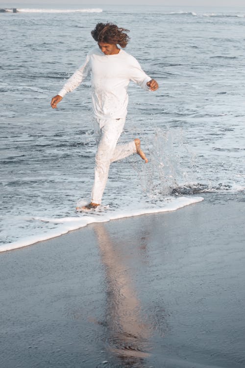 A Man Running on the Beach