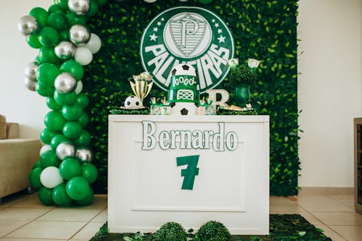 Vibrant football-themed birthday party setup with cake and decorations.
