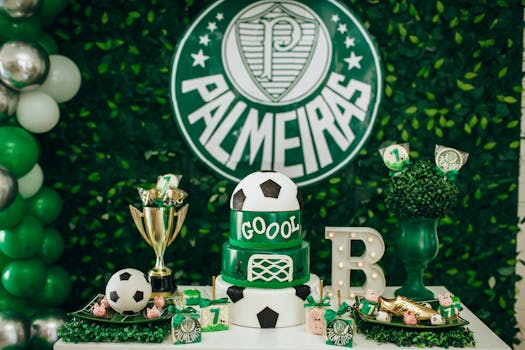 Bright and festive soccer-themed birthday party with decorations, cake, and Palmeiras logo.