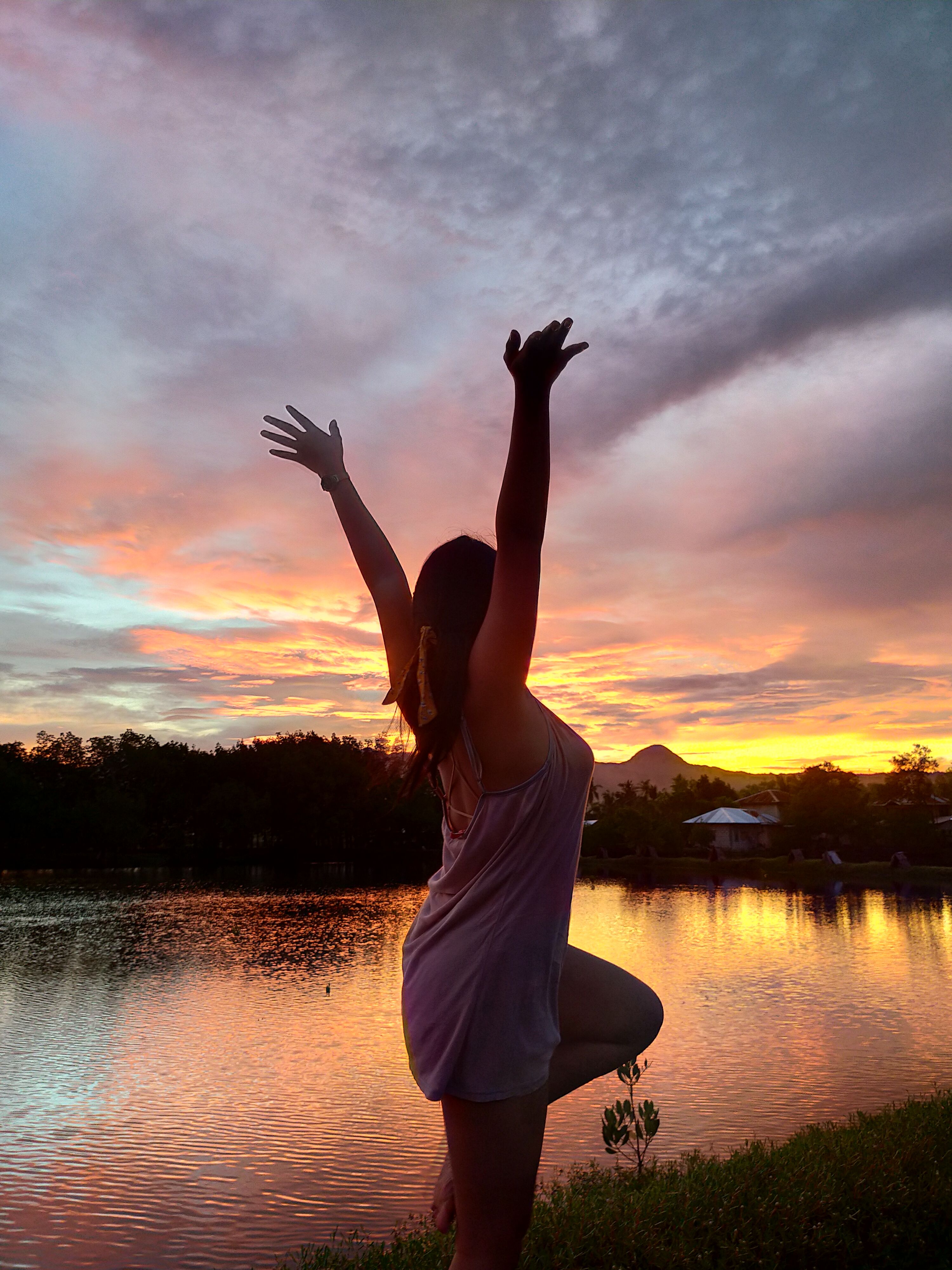 A Woman in Mini Dress Raising Her Hands · Free Stock Photo