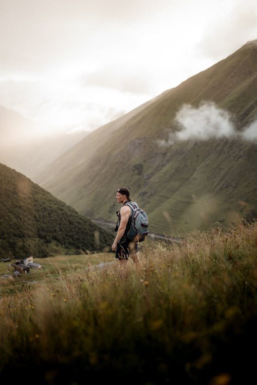 Man with a Backpack in Mountains 