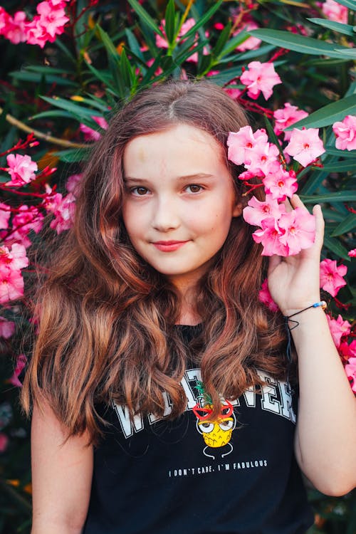 Pretty Girl Posing With Pink Flowers 