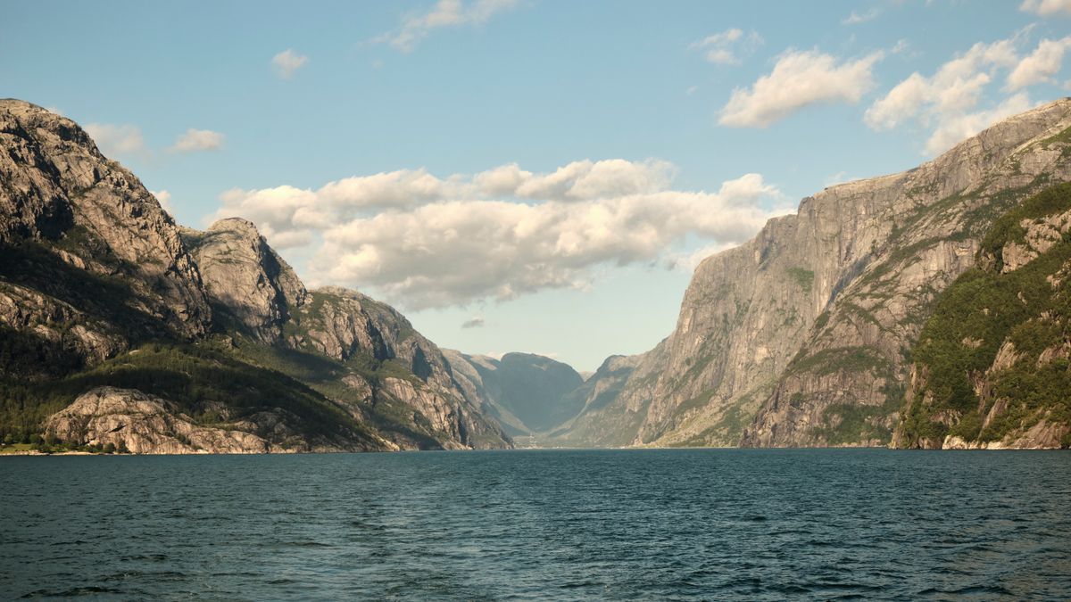A steep Norwegian fjord with deep, cold, clear water