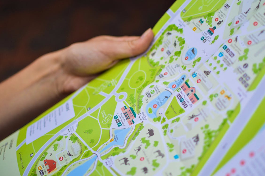 Free Person Holding City Map Stock Photo