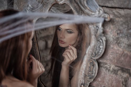 A Reflection of a Woman in the Mirror