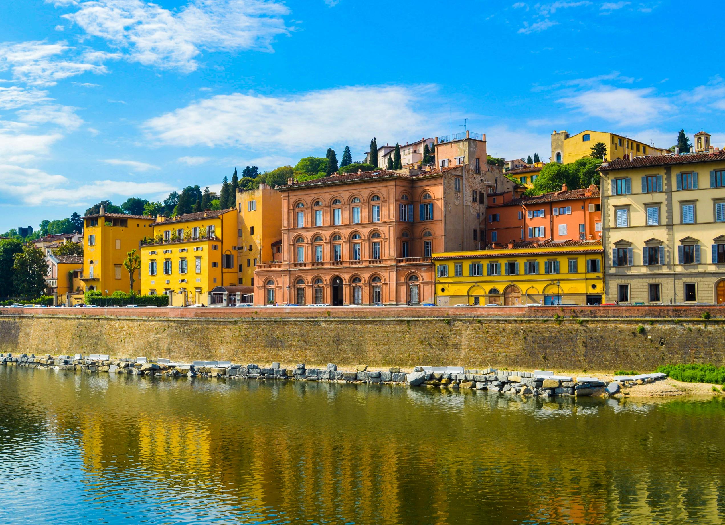 yellow and orange buildings near river