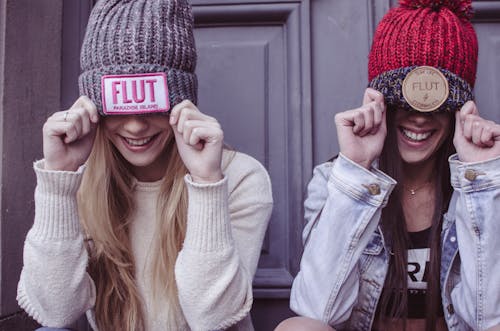 Two Women's Gray and Red Flut Knit Caps