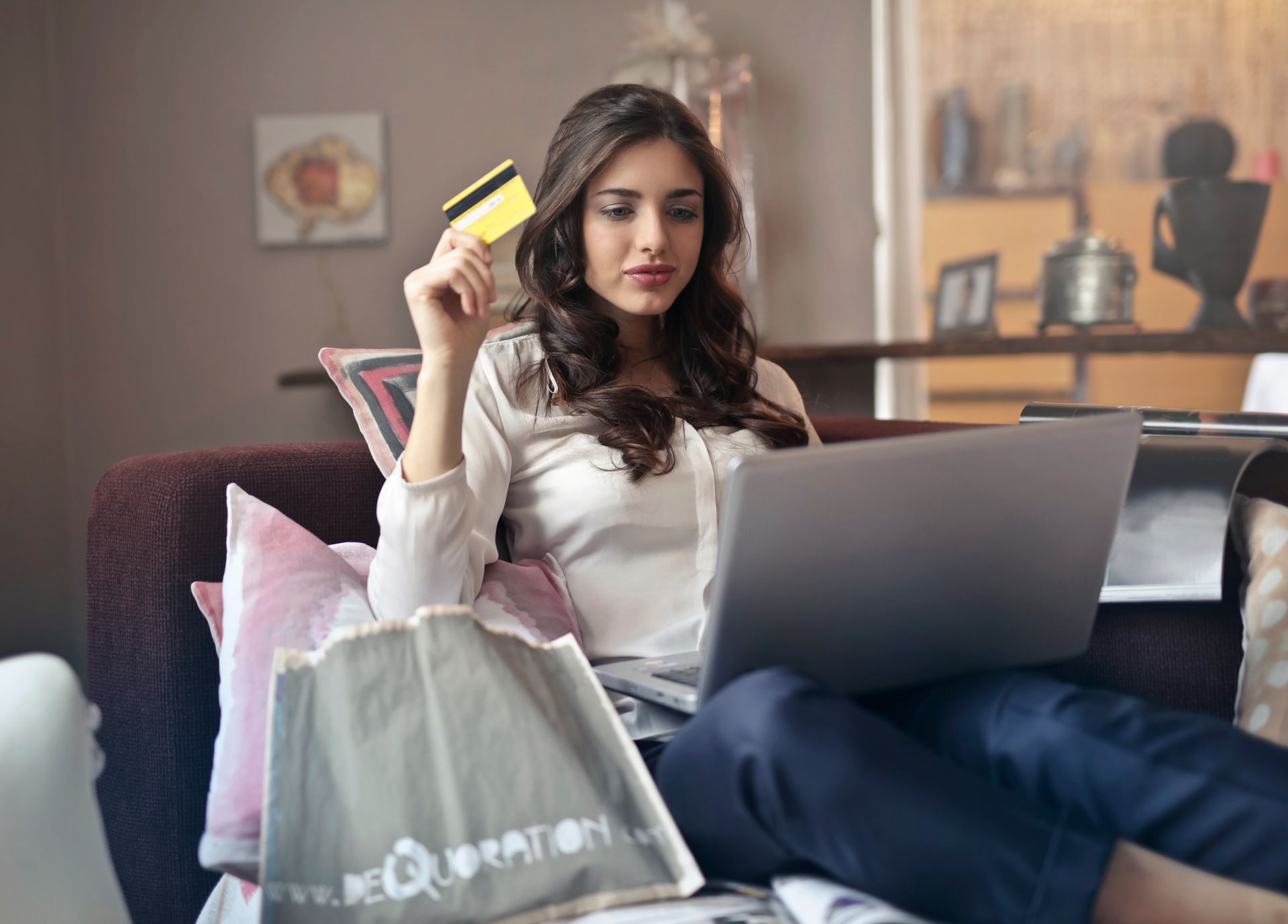 Paying with a card at a laptop