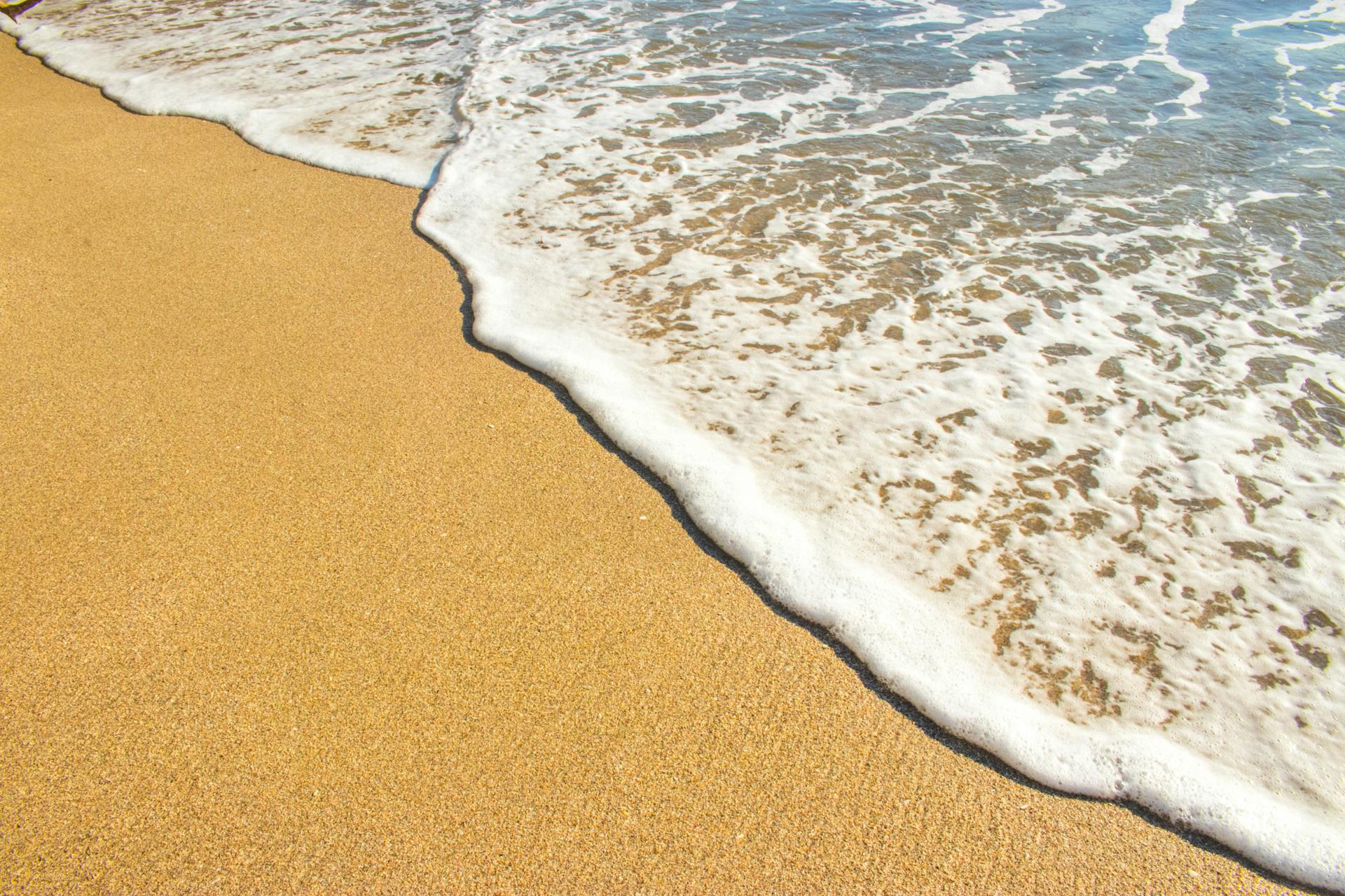 Brown Sand and Body of Water