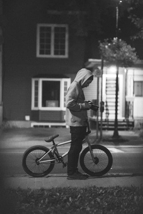 Man with a Bicycle Holding a Camera