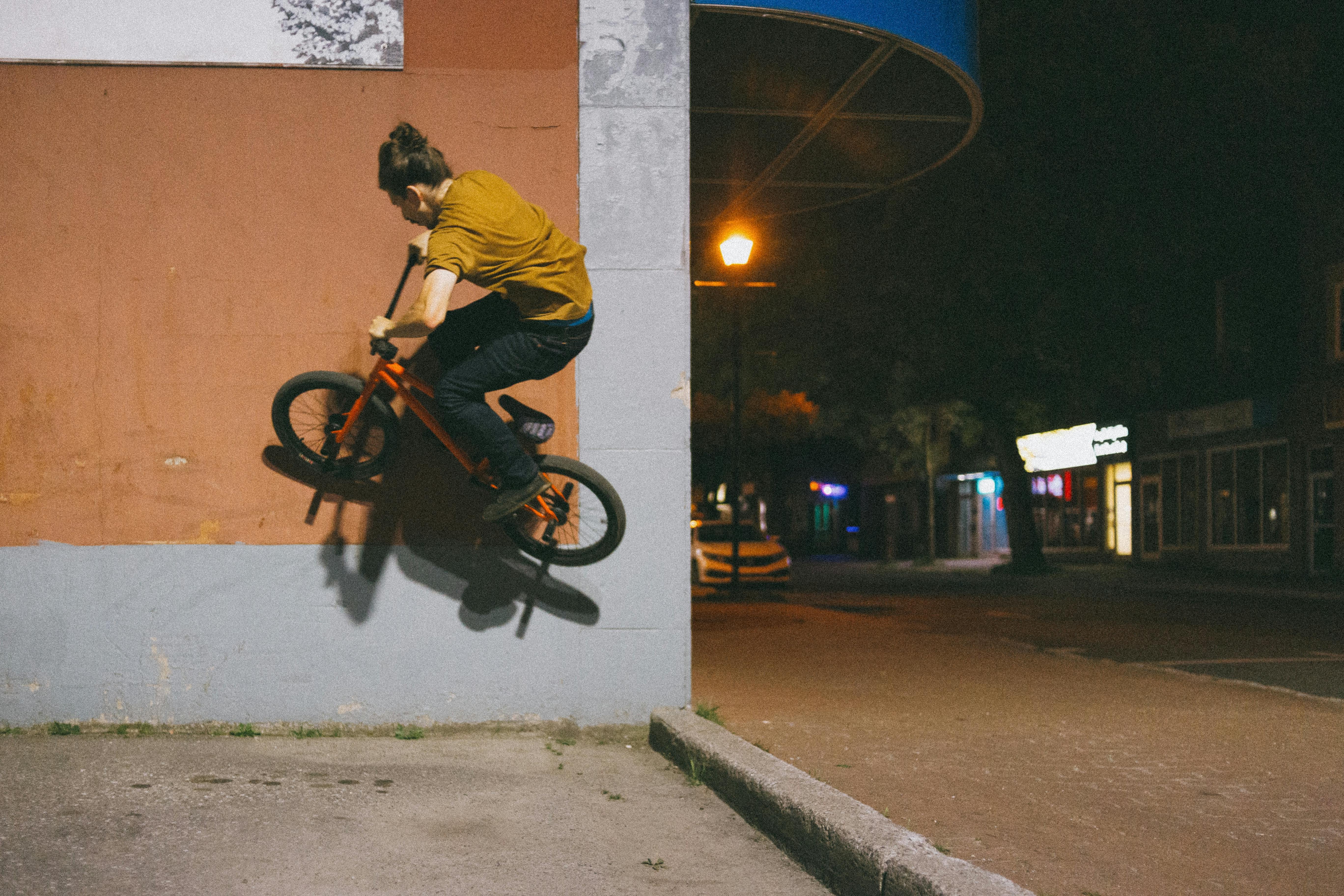 A Man Doing A Stunt With A Bike · Free Stock Photo