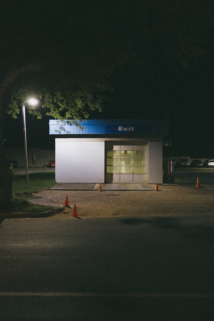 Small Building On Empty Street At Night