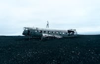 Person Standing on Wrecked Plane