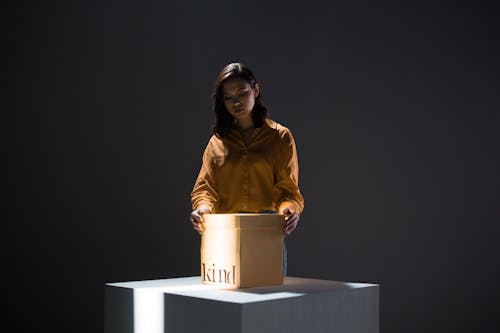 Woman opening a Carton Box