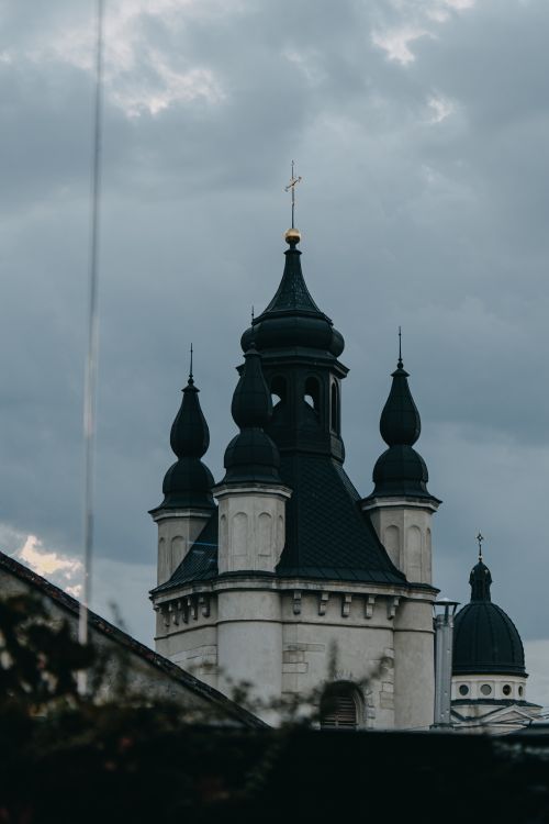 Free A dramatic view of Orthodox church towers in Lviv, Ukraine, captured on an overcast day. Stock Photo
