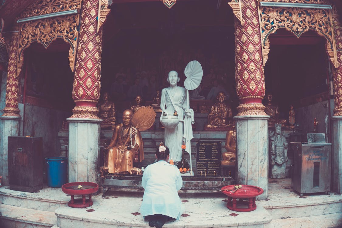 Woman Praying at Shrine