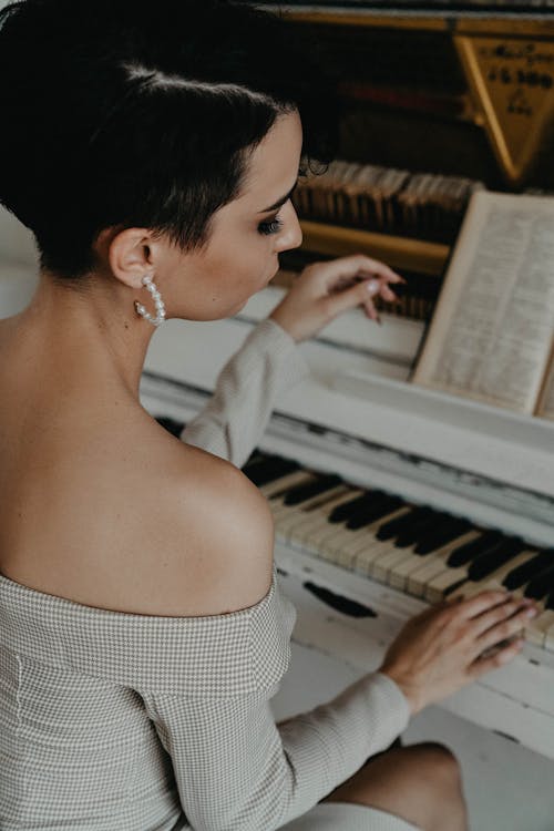 An Elegant Woman Playing Piano