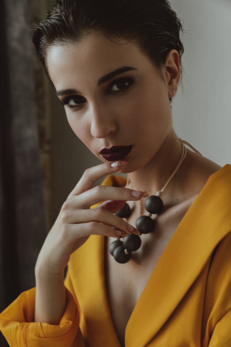 Woman In Yellow Top And Dark Red Lipstick