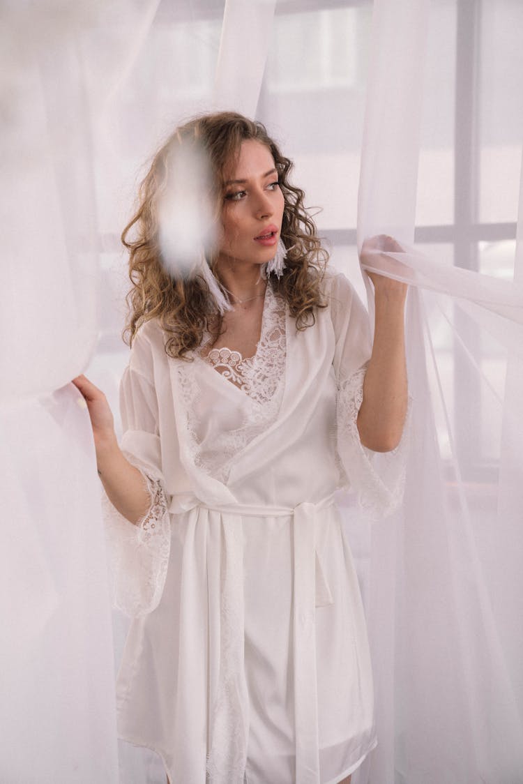 Photo Of A Woman Wearing White Silk Robe