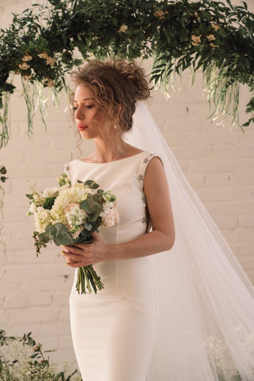 A Bride Holding Bouquet of Flowers