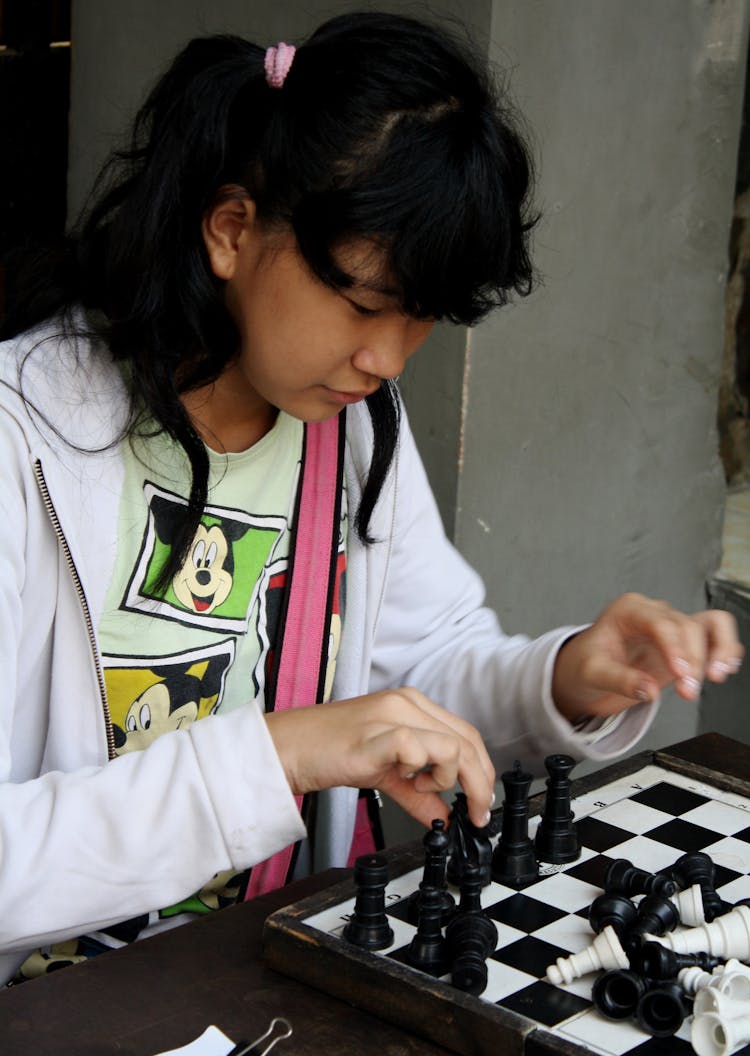 Girl Playing Chess