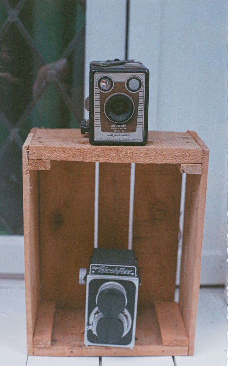 Vintage Cameras On Brown Wooden Crate