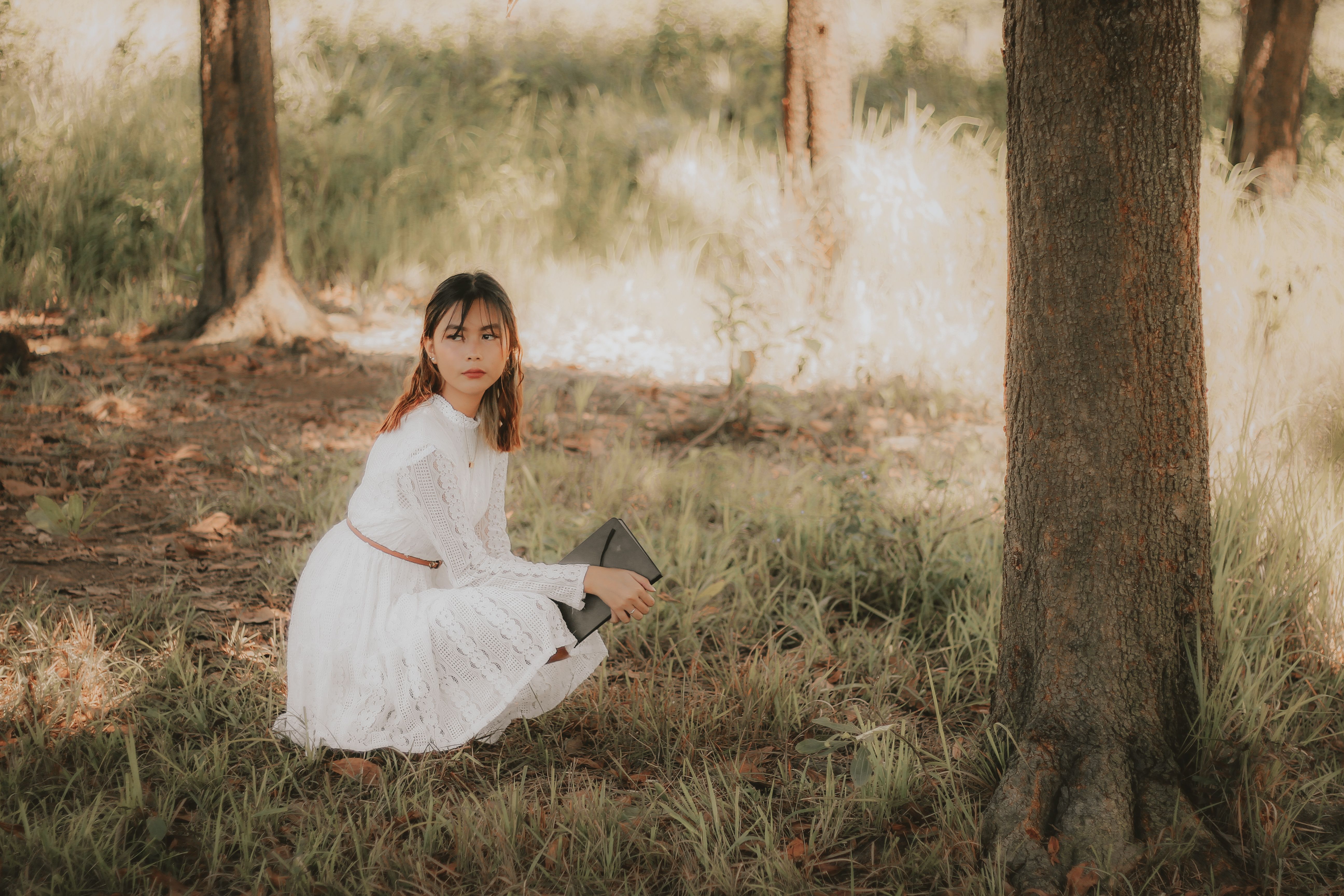 Woman in White Dress sitting under a Tree · Free Stock Photo