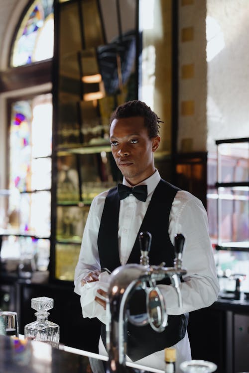 Free Bartender standing behind the Counter  Stock Photo