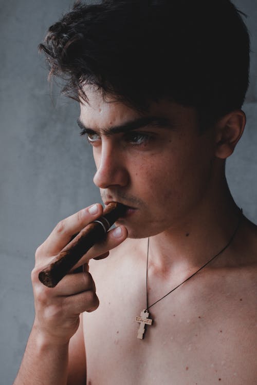 Free Shirtless Man Smoking Cigar Stock Photo